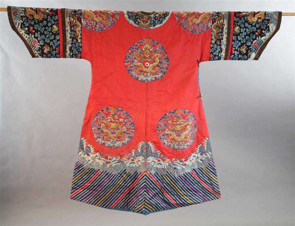 A Chinese red satin dragon winter robe, late Qing dynasty, length 129cm